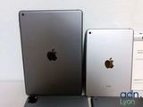 two ipads sitting next to each other on a table