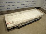 un matelas posé sur une palette au milieu d'une pièce