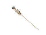 an antique gold stick with a lizard on it