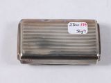a close up of a silver cigarette case on a white surface