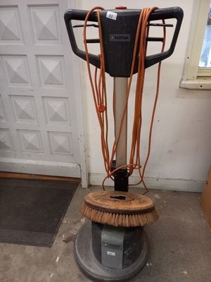 une image représentant une autolaveuse équipée d'un balai