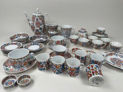 many different types of dishes and cups on the table