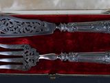 two forks and a knife in a box
