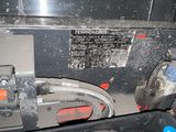 a close up of a machine with a lot of dirt on it
