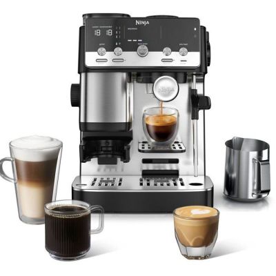 an image of a coffee machine with a cup of coffee next to it