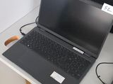 two laptops that are sitting on a table