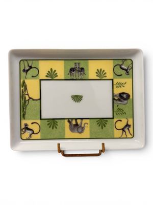 yellow and green tray with monkeys and palm trees on it
