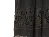 an image of a woman wearing a black dress with black lace on it