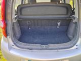 the back of a car with the trunk open and the seats folded down