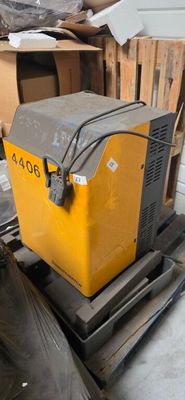 a yellow and black box sitting on top of a pallet