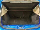 the back of a blue car with its trunk open and the seat down