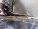 a statue of an elephant that is sitting on a table
