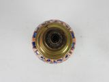 a gold candle holder with a colorful design on it
