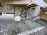 a close up of a truck ' s rear end with a chain attached to it