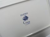 a white toilet with a blue emblem on it