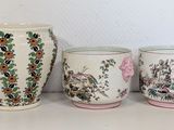 three vases that are sitting on a table