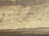 a piece of paper with writing on it sitting on a table