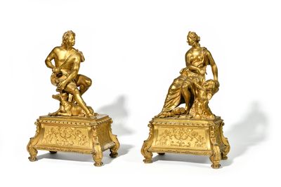 pair of antique bronze figurines of a man and a woman