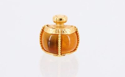 an image of a gold and tiger ' s eye perfume bottle