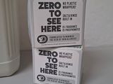 two boxes of zero to see here soap next to a white container