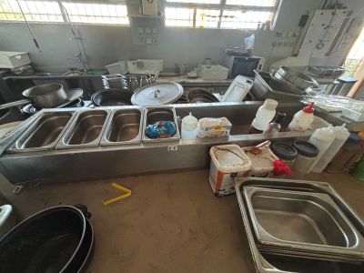 a large kitchen with a lot of dishes on the counter