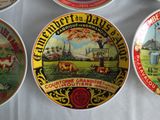 four plates that are on a table with a white table cloth