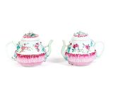 pair of pink and white teapots with floral designs on them