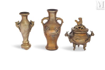 three vases sitting next to each other on a white surface