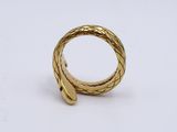 a close up of a gold ring on a white surface
