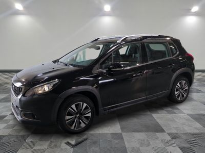 the black suv is parked on a checkered floor in a garage