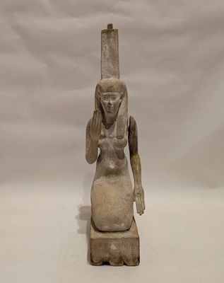 an egyptian statue of a woman holding a baby in her arms