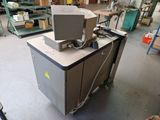 a machine that is sitting on a table in a warehouse