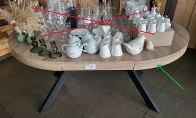 a table that has a lot of cups and mugs on it