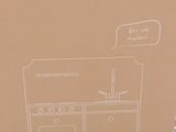 cardboard box with a drawing of a kitchen in it on a table