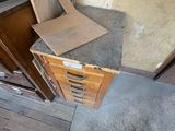 a pile of cardboard sitting on the floor next to a door