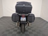 a picture of a motorcycle parked on a checkered floor