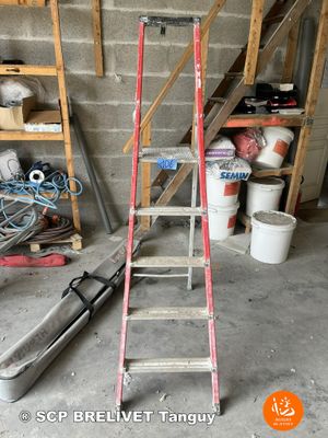 a ladder that is leaning against a wall in a garage
