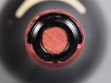 a close up view of a wine bottle with a cork