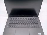 laptop computer with a black keyboard on a white surface