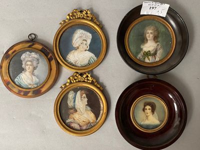 four miniature portraits of women are hanging on a wall