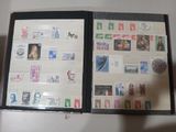 a picture of an open book with stamps on it