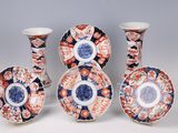 four different types of japanese porcelain vases and plates on a table