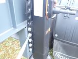 a black box sitting next to a black box on the ground