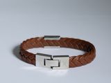 a brown leather bracelet with a stainless clasp