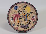 an image of a decorative plate with flowers on it
