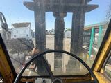 a view of the inside of a truck from the driver ' s seat