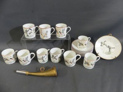 a lot of coffee cups and saucers on the table