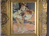 painting of a ballerina in a gold frame on a wall
