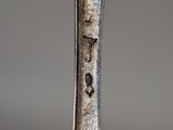 a close up of a spoon with a fork on it