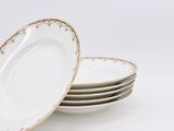 three plates with floral designs are stacked on top of each other